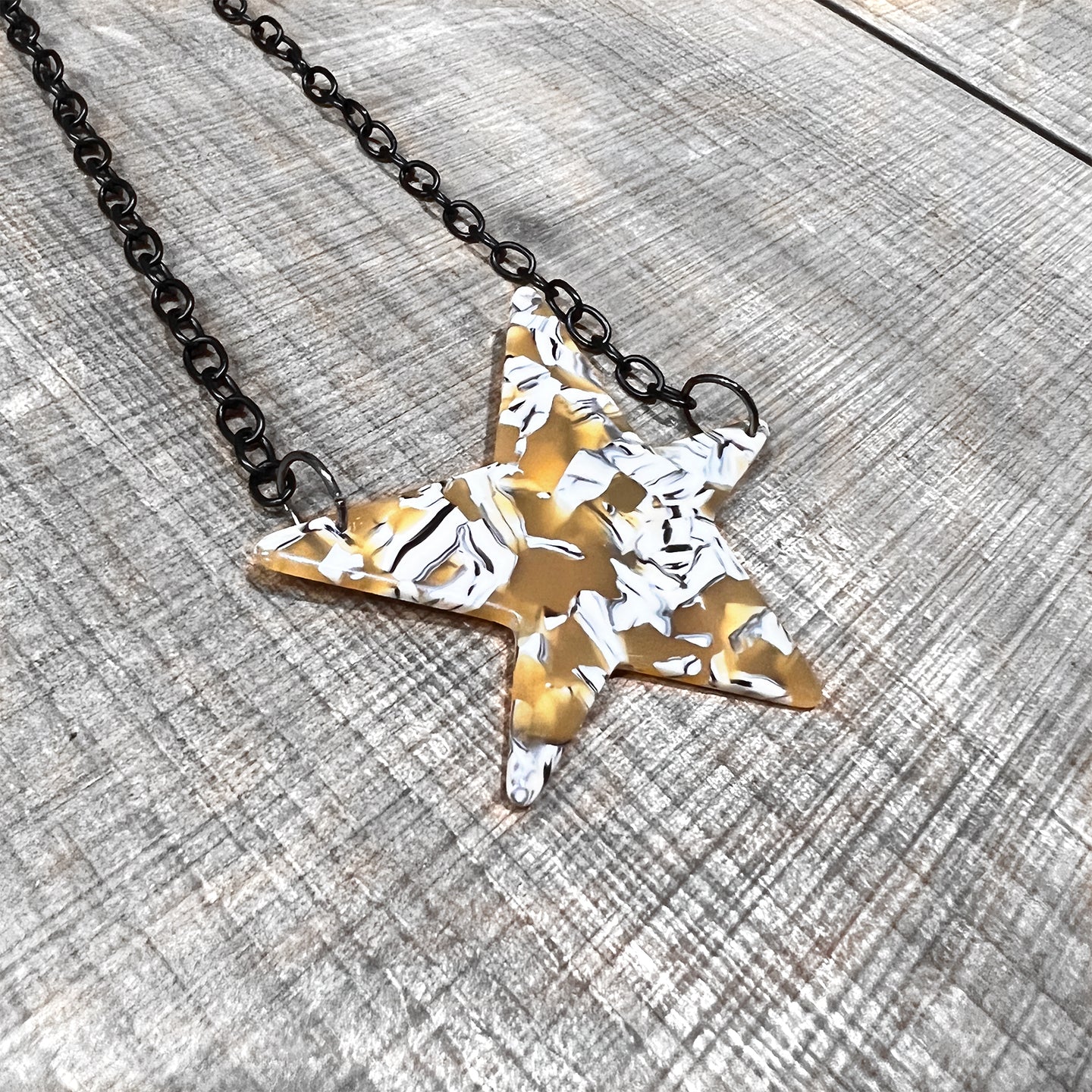 Acrylic Tortoise Shell Star Necklace on Black Chain