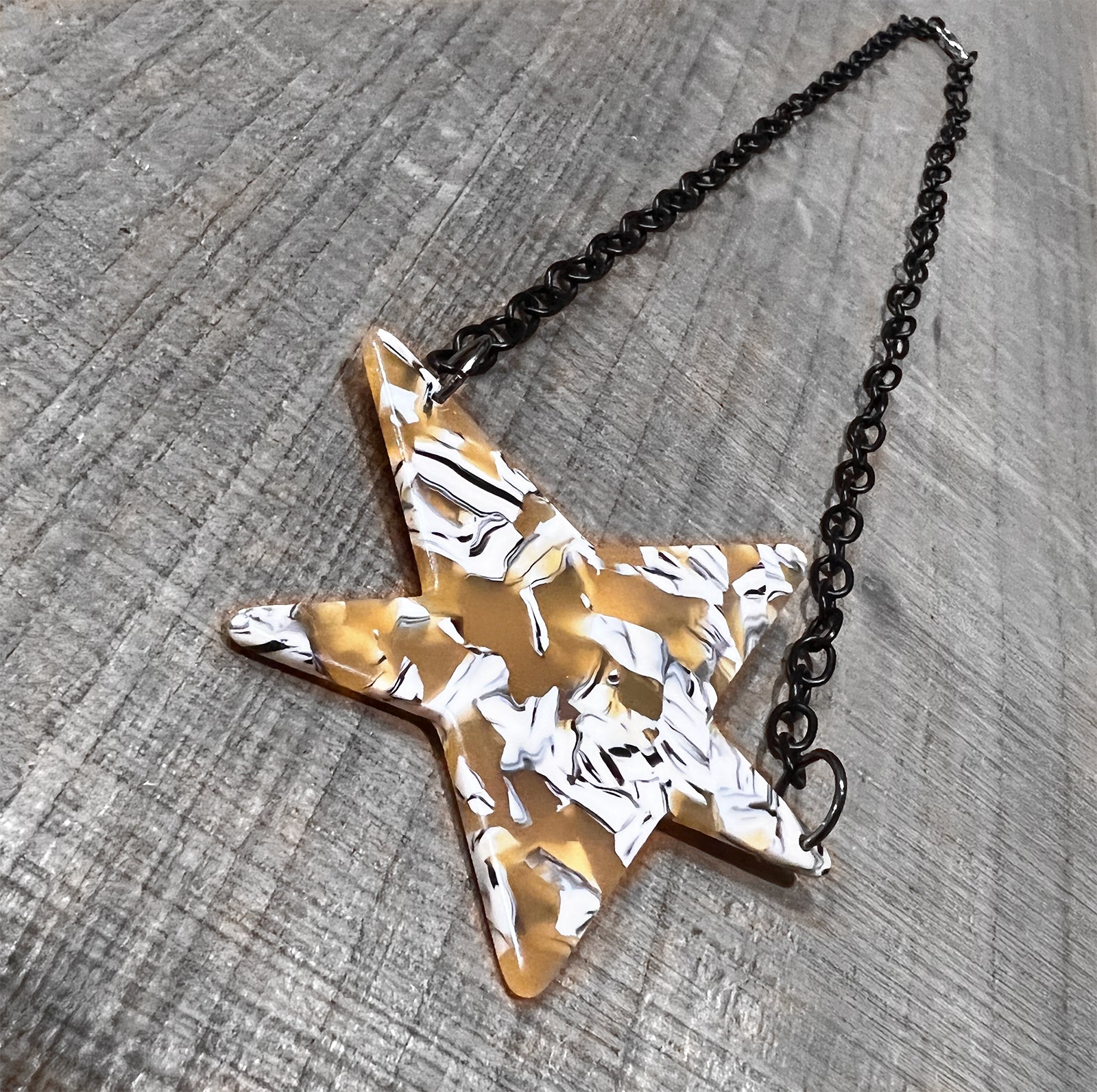 Acrylic Tortoise Shell Star Necklace on Black Chain